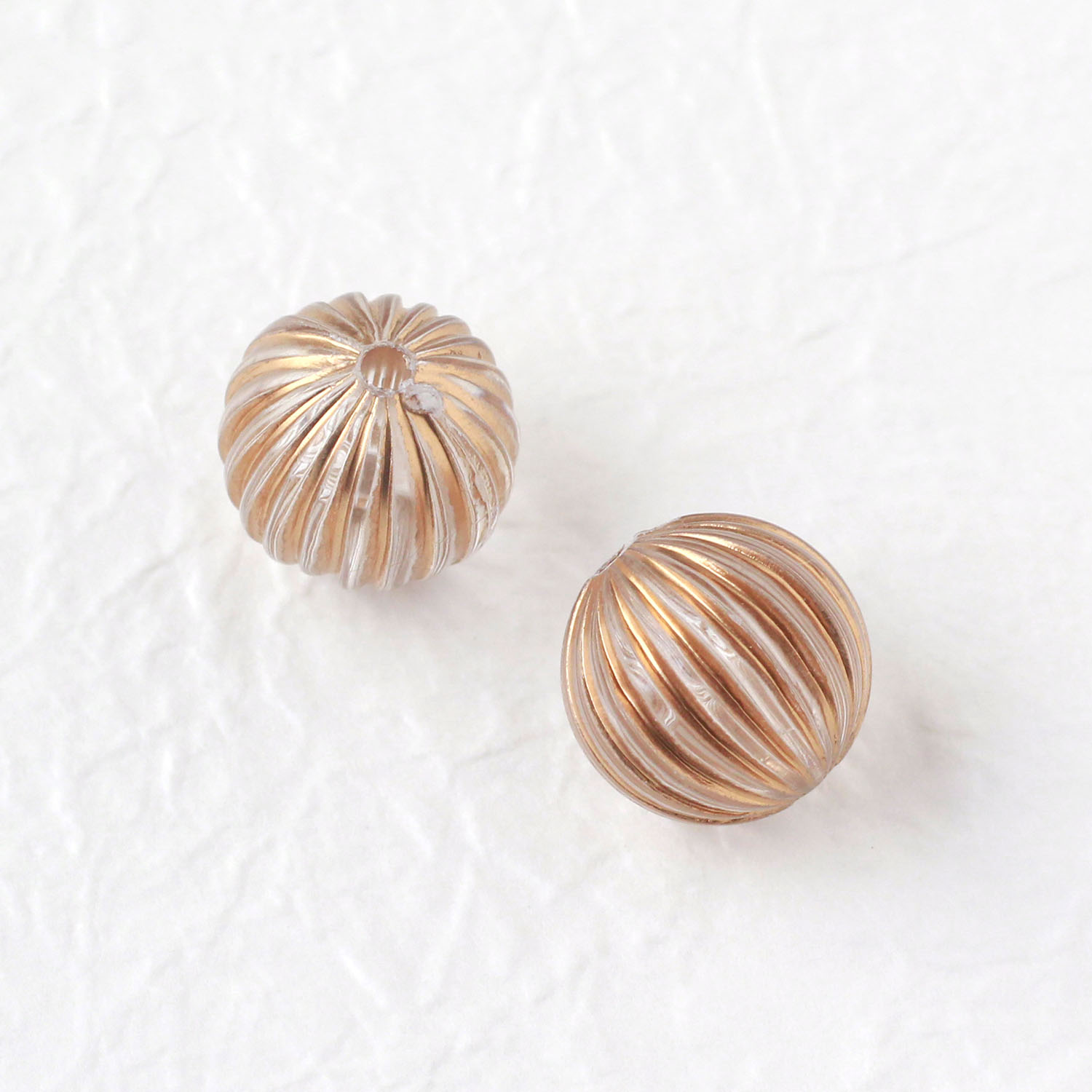 KE1428 アクリルビーズ クリア×ゴールド だ円 10個入 (袋)「手芸材料の卸売りサイトChuko Online」