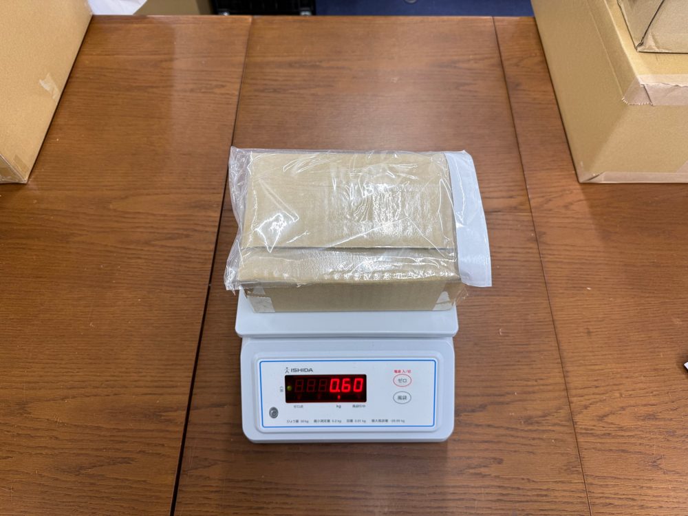 Open shipping box containing craft supplies for United States, New York State